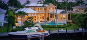 Luxury Park Shore mansion with boat lift and in-ground pool on waterfront in Naples Florida