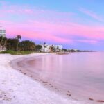 Sandy beach at Lowdermilk Park in Naples, FL at sunset