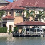 Two-story canal home and boat dock