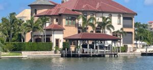 Two-story canal home and boat dock