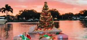 Sunset with a Christmas tree on a floating island in middle of Florida canal
