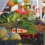 People shopping at outdoor farmers market in Naples, Florida